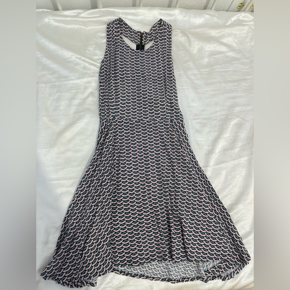 Cute short flowy dress, with cutout back.